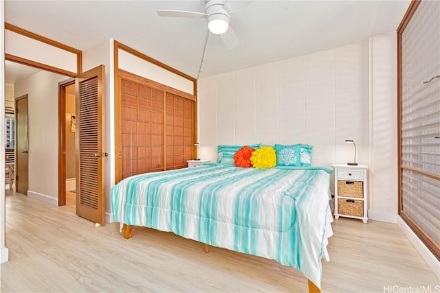 bedroom featuring a closet, ceiling fan, and light hardwood / wood-style floors