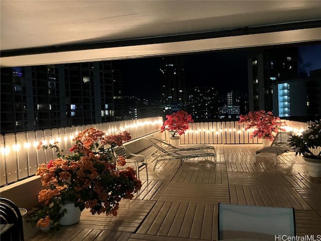 view of balcony at twilight