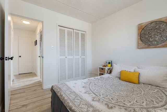 24 Hialoa St Unit 41, Honolulu, HI 96817 - bedroom with baseboards, a closet, and light wood-type flooring