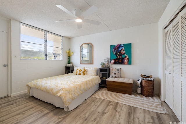 24 Hialoa St Unit 41, Honolulu, HI 96817 - bedroom with a textured ceiling, wood finished floors, and a closet