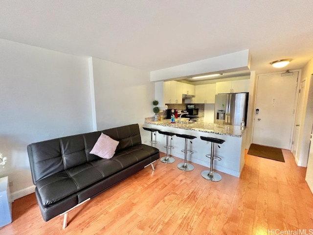 living room featuring light wood-type flooring