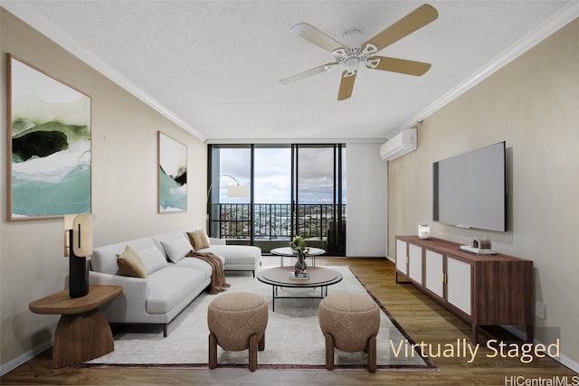 living room featuring crown molding, hardwood / wood-style flooring, an AC wall unit, and floor to ceiling windows