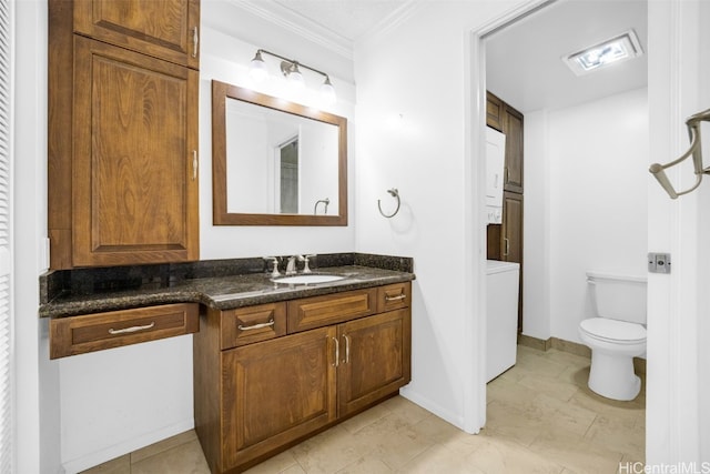 bathroom featuring vanity, ornamental molding, and toilet