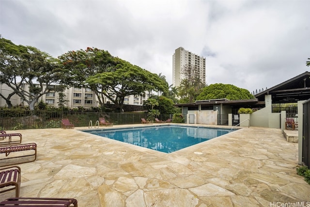 view of swimming pool featuring a patio area