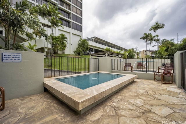 view of swimming pool featuring a patio