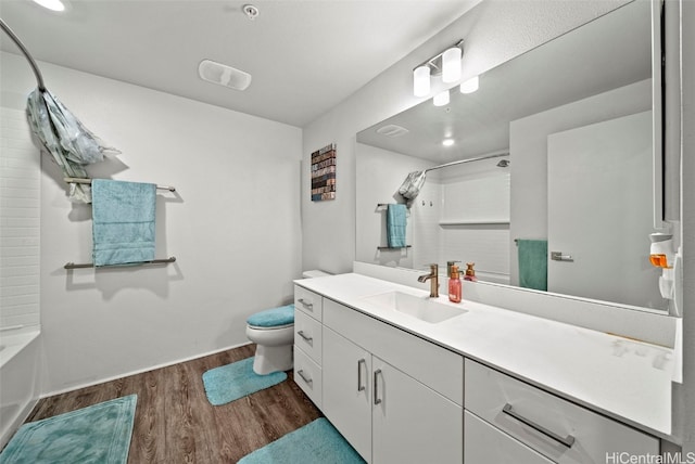 full bathroom featuring vanity, toilet, shower / tub combo, and hardwood / wood-style floors