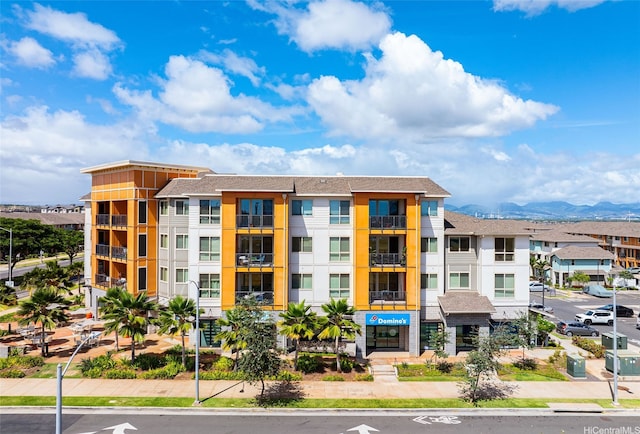 view of building exterior featuring a mountain view