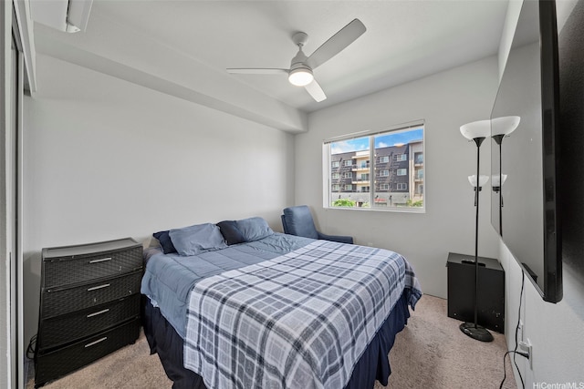 carpeted bedroom featuring a ceiling fan