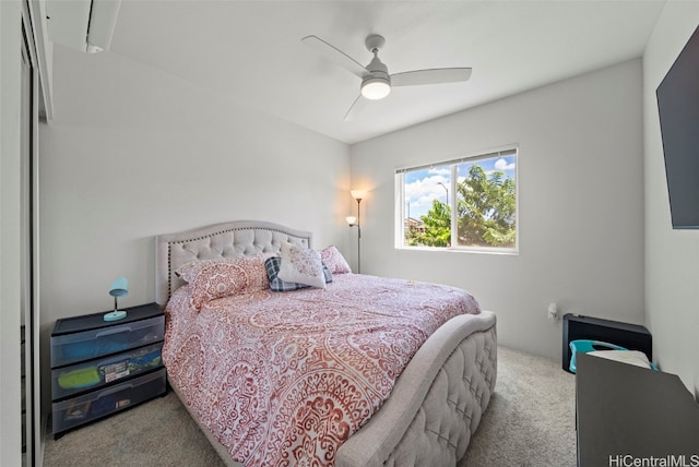 bedroom featuring light carpet and ceiling fan