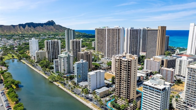 drone / aerial view with a water and mountain view