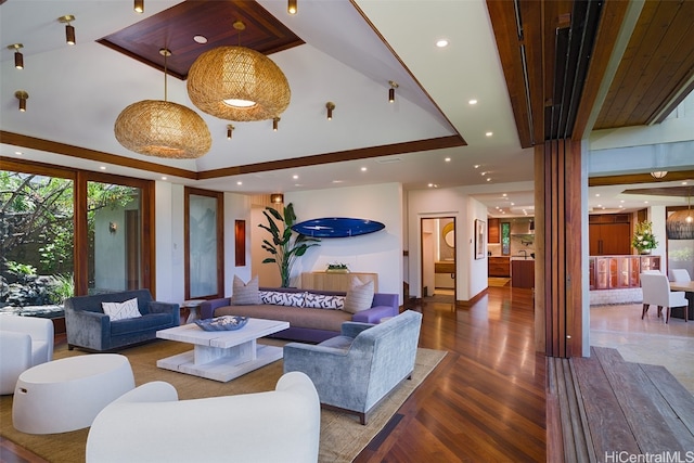 living room featuring hardwood / wood-style floors and a tray ceiling