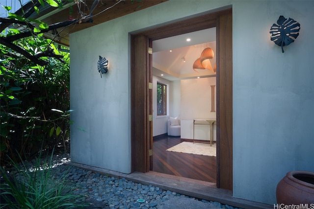 view of exterior entry featuring covered porch