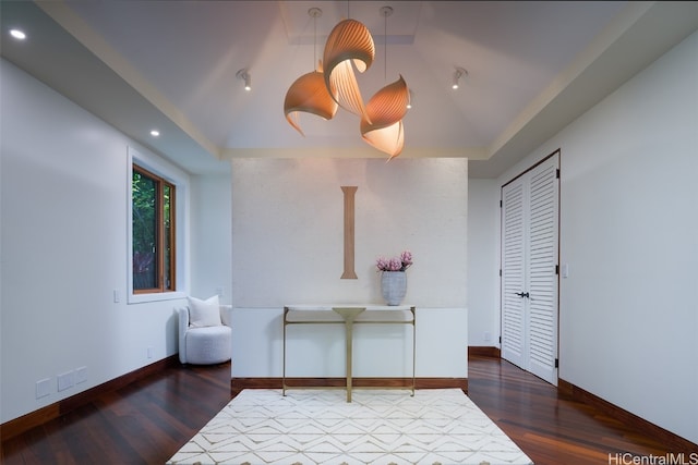 living area with lofted ceiling and dark hardwood / wood-style floors