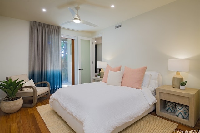 bedroom featuring wood-type flooring, access to outside, and ceiling fan