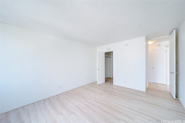 spare room with light hardwood / wood-style flooring