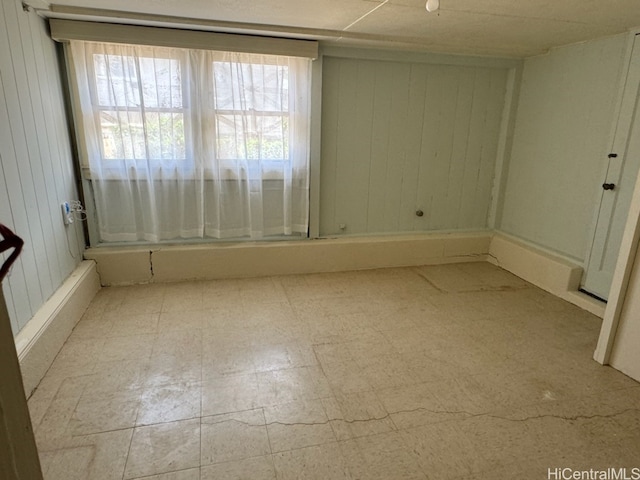 empty room with wooden walls