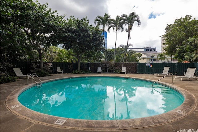 view of swimming pool with a patio