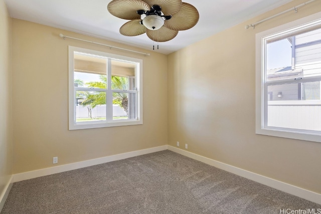 unfurnished room with carpet and ceiling fan