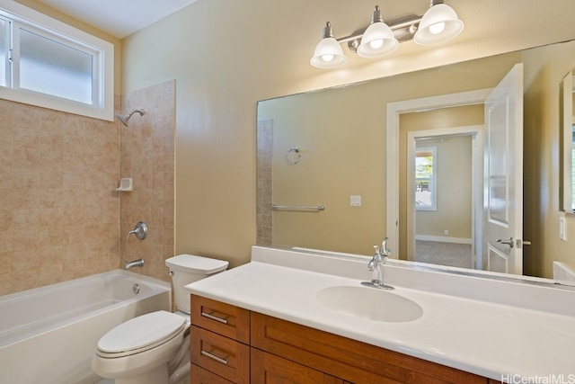 full bathroom featuring vanity, toilet, and tiled shower / bath combo