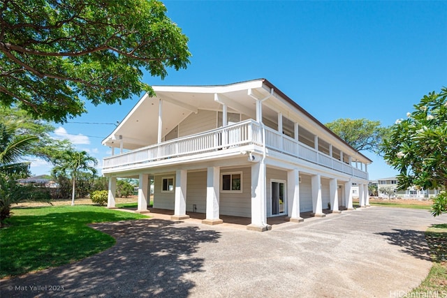 view of side of property with a yard