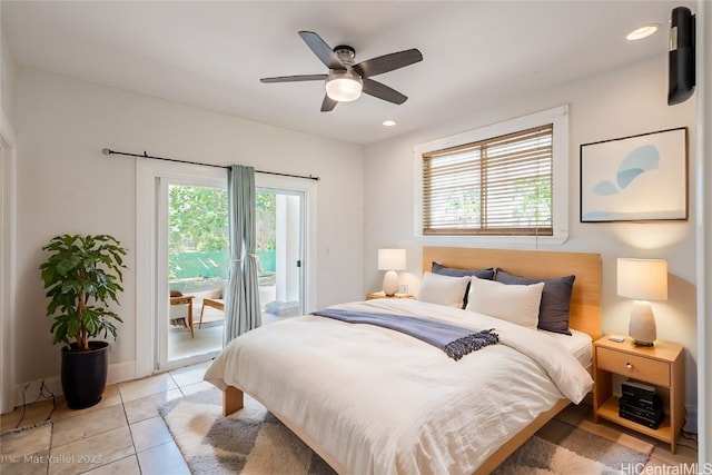 tiled bedroom with access to outside and ceiling fan