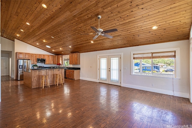 unfurnished living room with wood ceiling, ceiling fan, high vaulted ceiling, dark wood-type flooring, and french doors