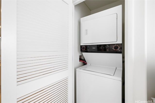 washroom with stacked washer and dryer