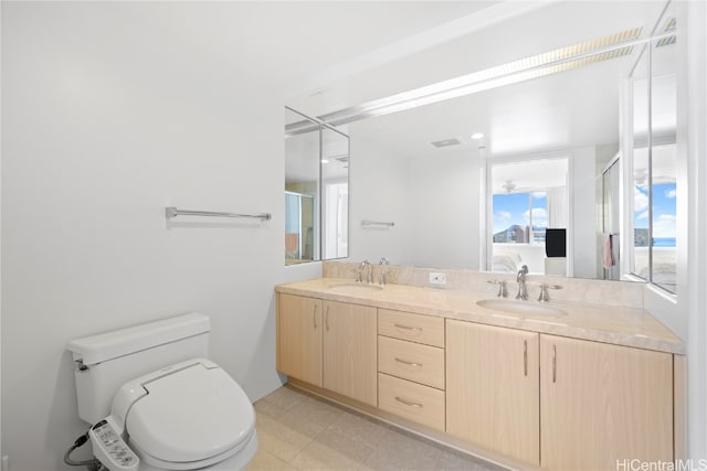 bathroom featuring vanity, toilet, and walk in shower