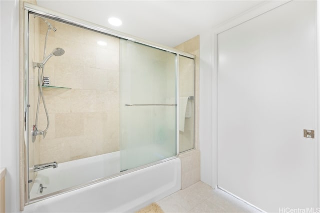 bathroom featuring combined bath / shower with glass door and tile patterned flooring