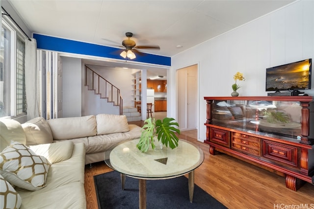 living room with hardwood / wood-style flooring and ceiling fan