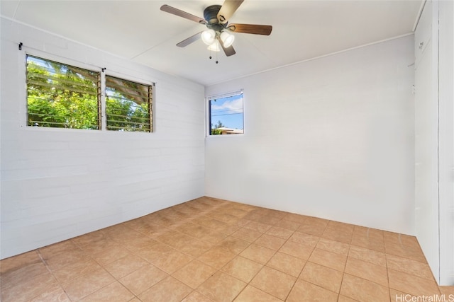 unfurnished room with ceiling fan