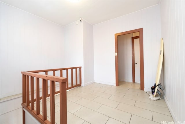 hall featuring light tile patterned floors