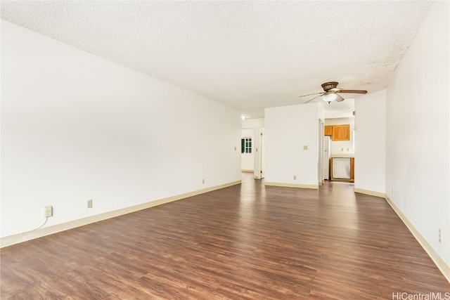 unfurnished living room with dark wood-type flooring, ceiling fan, and a textured ceiling