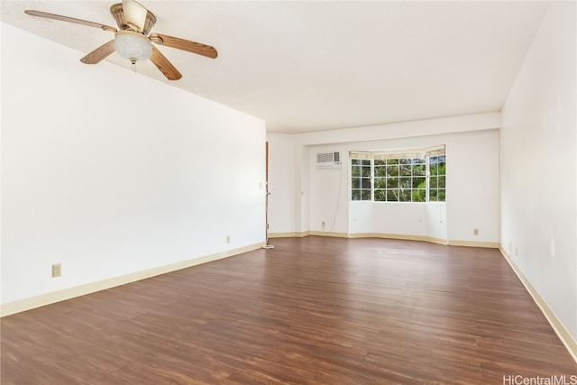 unfurnished room featuring a wall mounted air conditioner, dark hardwood / wood-style floors, and ceiling fan