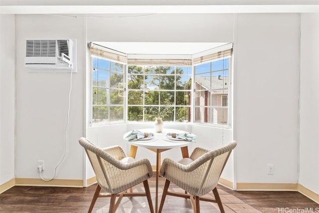 sunroom / solarium featuring plenty of natural light and a wall mounted AC