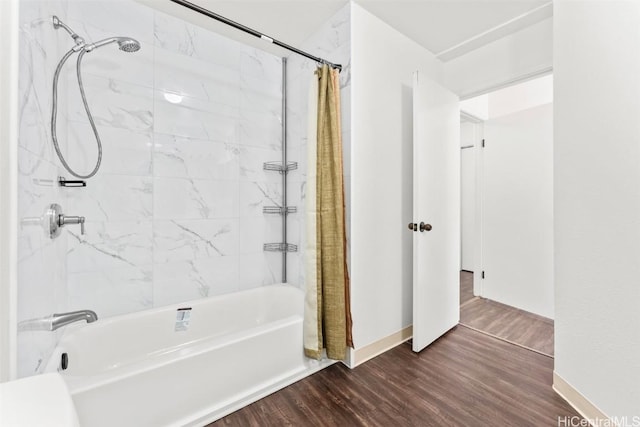 bathroom with shower / tub combo and wood finished floors