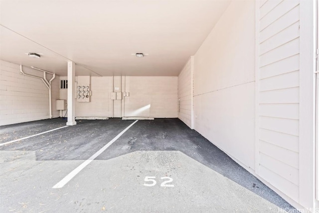 garage featuring concrete block wall