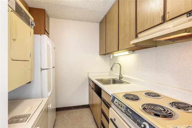 kitchen with sink, electric range, and a textured ceiling