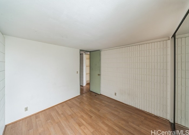 empty room featuring hardwood / wood-style floors