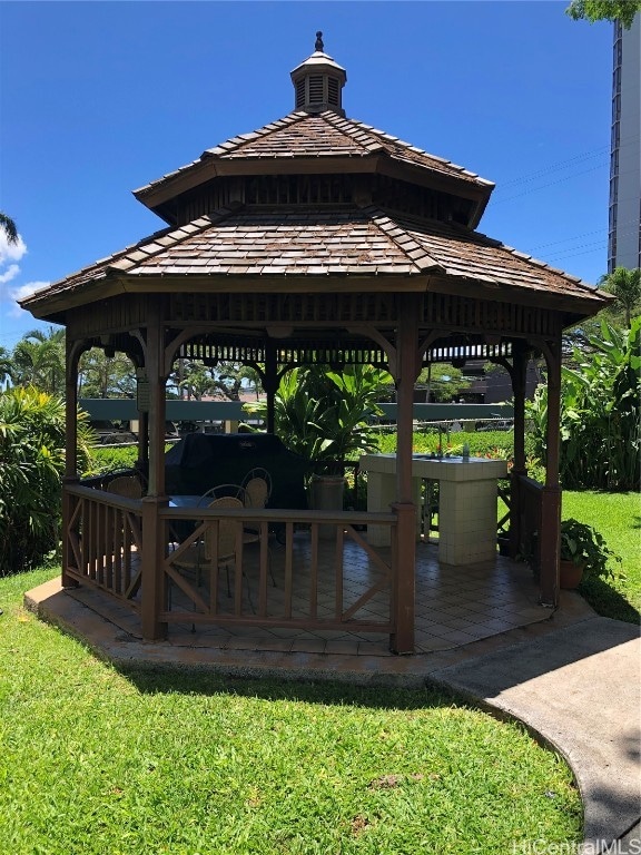 view of property's community featuring a yard and a gazebo