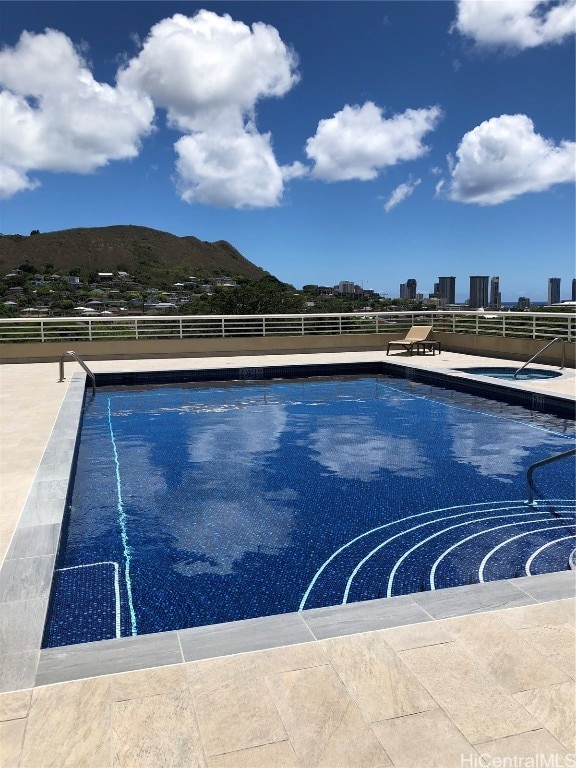 view of pool with a mountain view