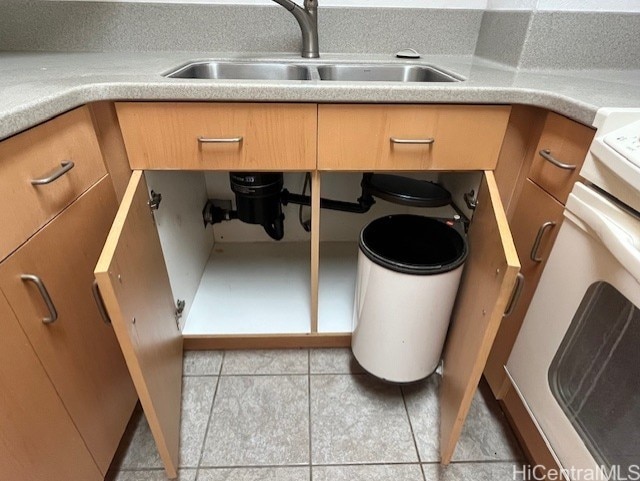 details with sink and light tile patterned floors