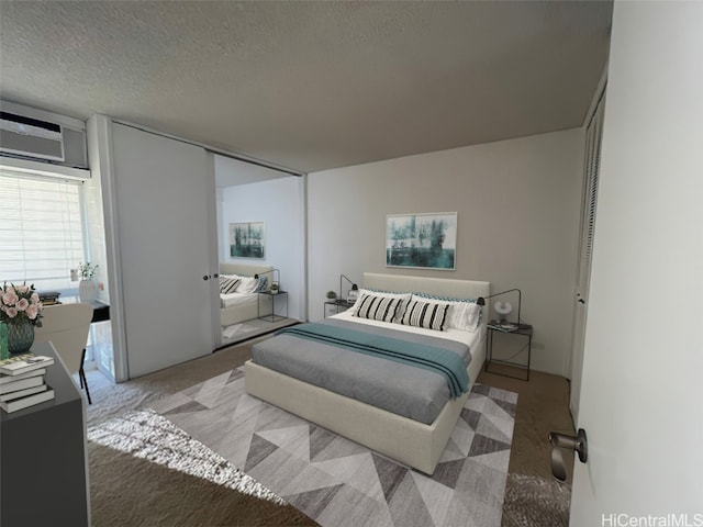 bedroom featuring a textured ceiling and light colored carpet