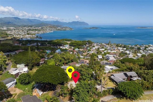 birds eye view of property featuring a water and mountain view