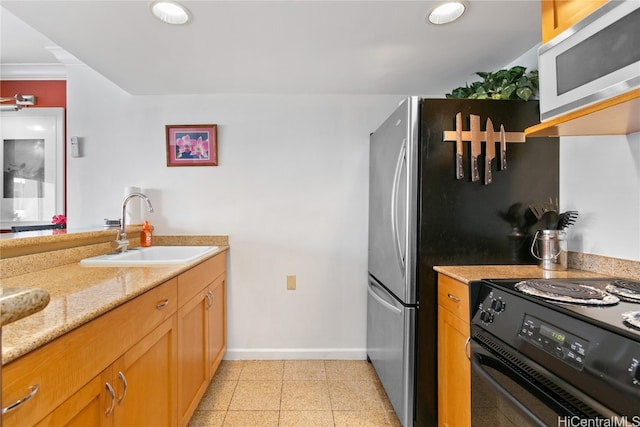 kitchen featuring sink, black / electric stove, light stone counters, and crown molding