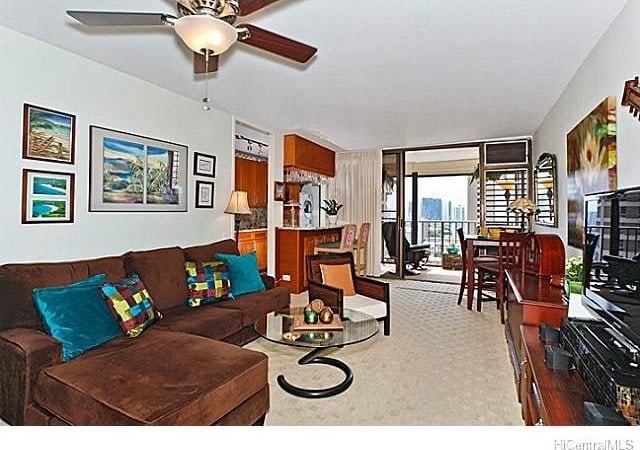 living room featuring ceiling fan