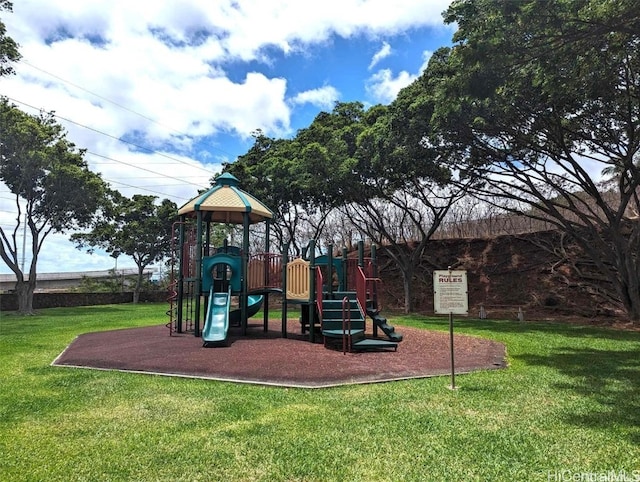 view of playground with a lawn