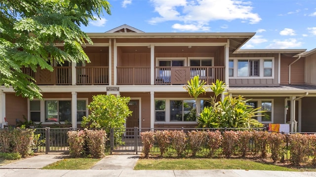 view of front of home featuring a balcony