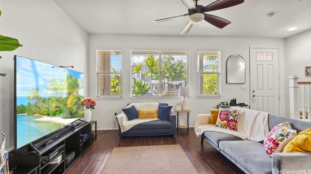 living room featuring dark hardwood / wood-style floors and ceiling fan