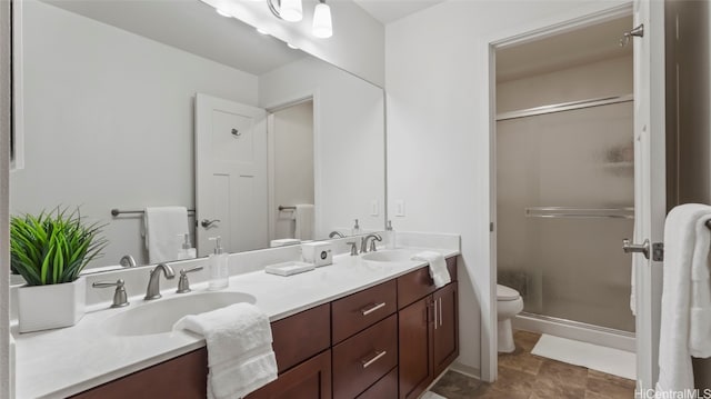 bathroom with toilet, an enclosed shower, and vanity